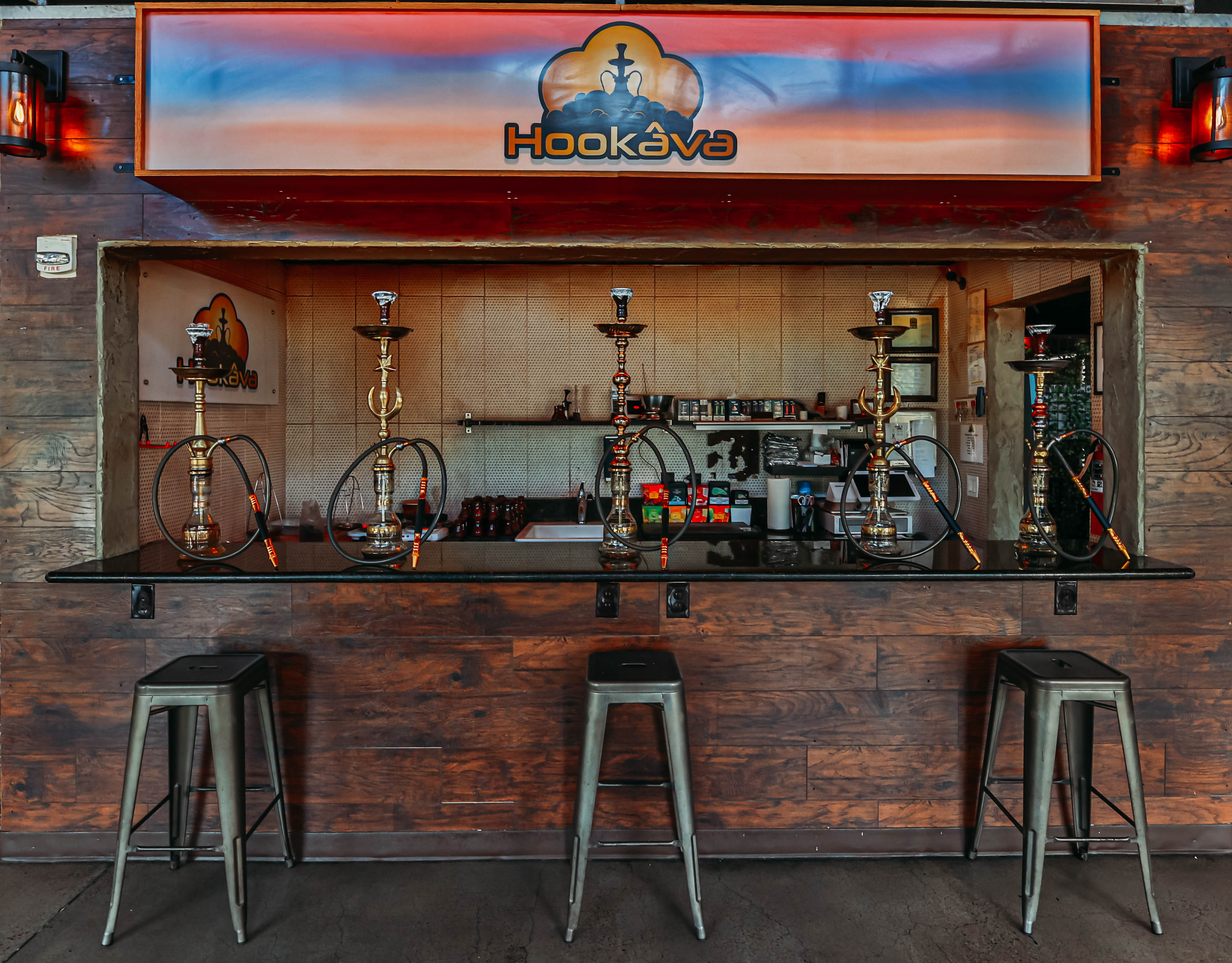 Hookava hookah bar station with premium hookahs on display